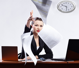 Woman working remotely clearing her desk